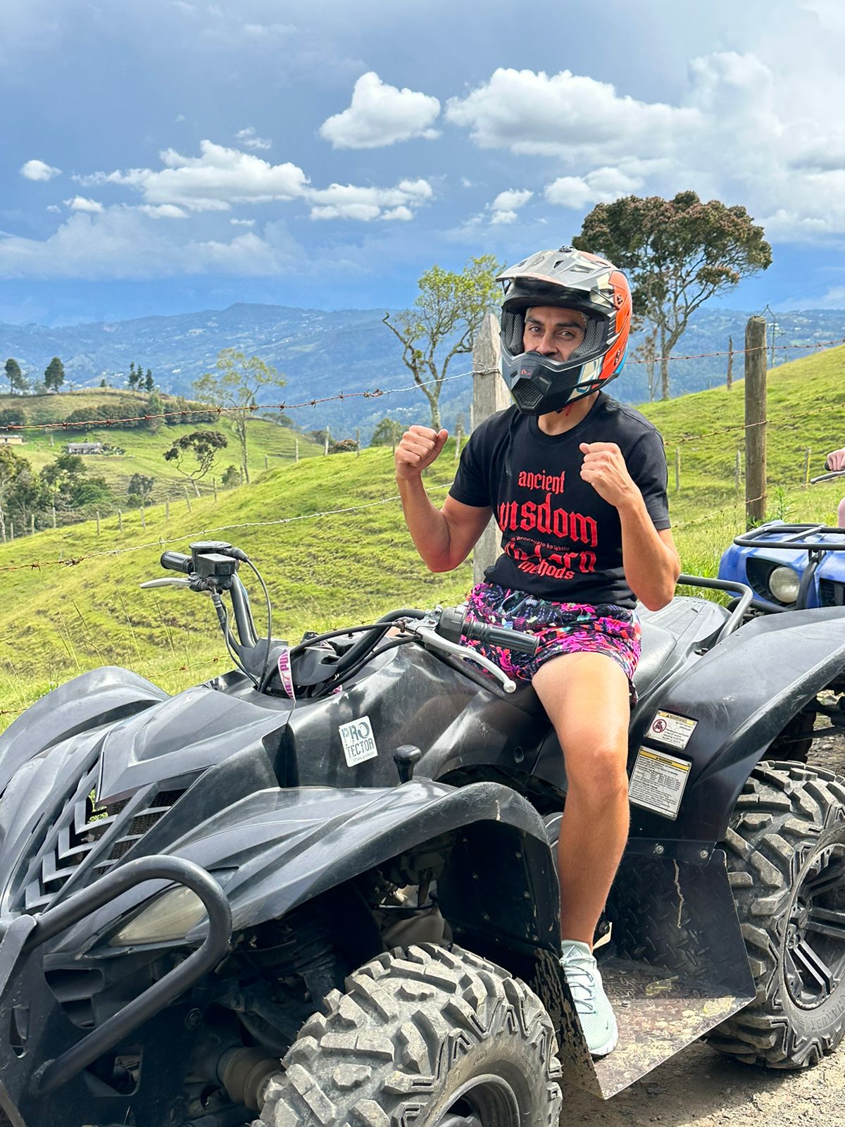 Sean outdoors on an ATV adventure
